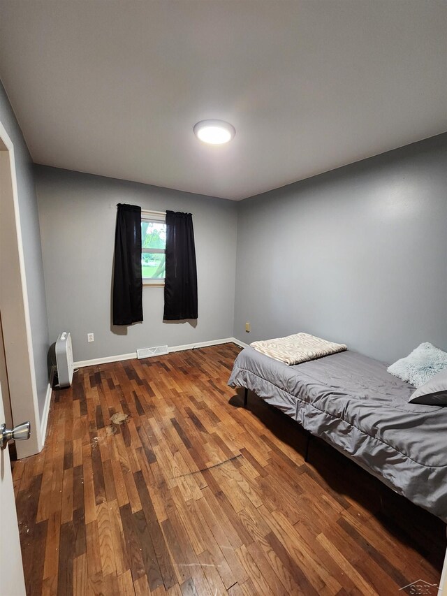 2285 Nebraska Ave, Saginaw, MI 48601 - bedroom with wood finished floors and baseboards