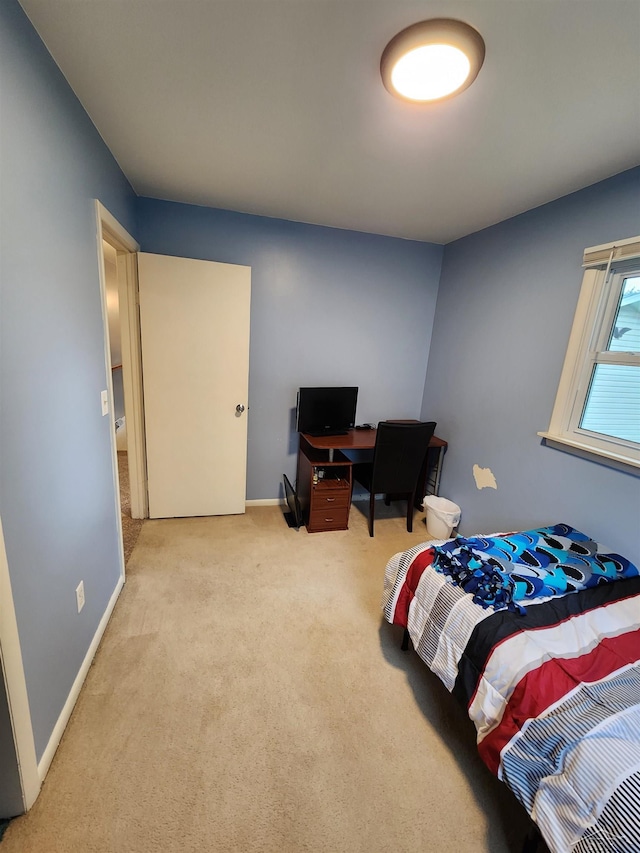 2285 Nebraska Ave, Saginaw, MI 48601 - bedroom with carpet flooring, baseboards, and a desk