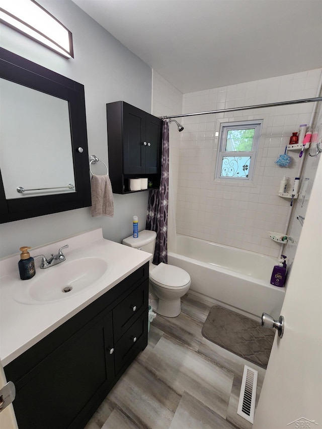 2285 Nebraska Ave, Saginaw, MI 48601 - bathroom with vanity, toilet, shower / bath combo, and wood finished floors