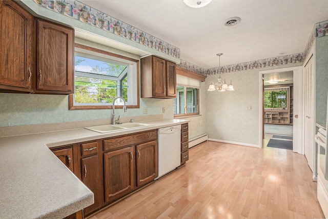 1269 Potomac Dr, Rochester Hills, MI 48306 - kitchen featuring dishwasher, a sink, a chandelier, a baseboard radiator, and light countertops