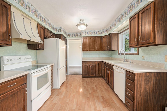 1269 Potomac Dr, Rochester Hills, MI 48306 - kitchen featuring white appliances, a sink, light wood-type flooring, light countertops, and exhaust hood