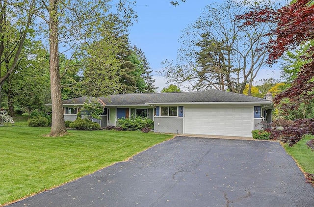 1269 Potomac Dr, Rochester Hills, MI 48306 - view of front of house with an attached garage, asphalt driveway, a front lawn, and a chimney