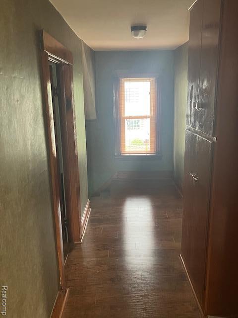 161 Fourth, Harbor Beach, MI 48441 - hallway with dark wood-style flooring and baseboards