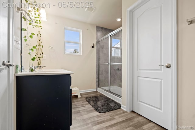 4782 Broomfield Way, Lake Orion, MI 48359 - full bathroom with a shower stall, vanity, wood finished floors, recessed lighting, and baseboards
