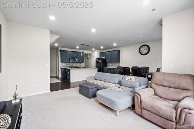 4782 Broomfield Way, Lake Orion, MI 48359 - living room with recessed lighting, dark carpet, and baseboards