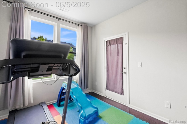 4782 Broomfield Way, Lake Orion, MI 48359 - exercise room featuring baseboards and wood finished floors