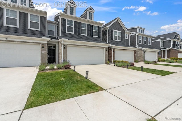 4782 Broomfield Way, Lake Orion, MI 48359 - multi unit property featuring concrete driveway, a garage, a front yard, and a residential view