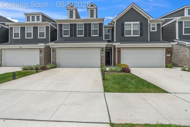 4782 Broomfield Way, Lake Orion, MI 48359 - view of property featuring an attached garage, brick siding, and concrete driveway