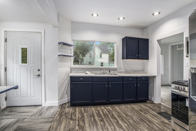 1702 Charles Ave, Kalamazoo, MI 49048 - kitchen with a sink, gas stove, dark wood-type flooring, open shelves, and light countertops