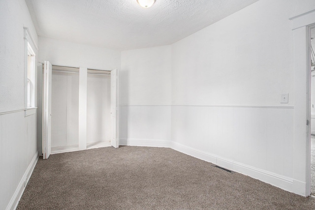 1702 Charles Ave, Kalamazoo, MI 49048 - unfurnished bedroom featuring carpet floors