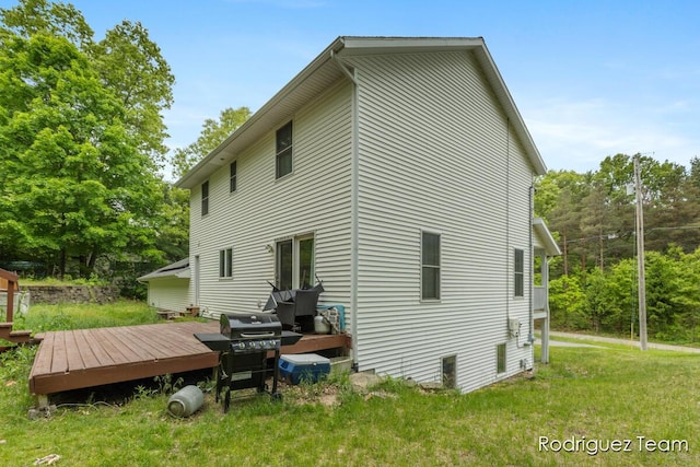 4160 Knapp Valley Dr NE, Grand Rapids, MI 49525 - rear view of house featuring a wooden deck and a yard