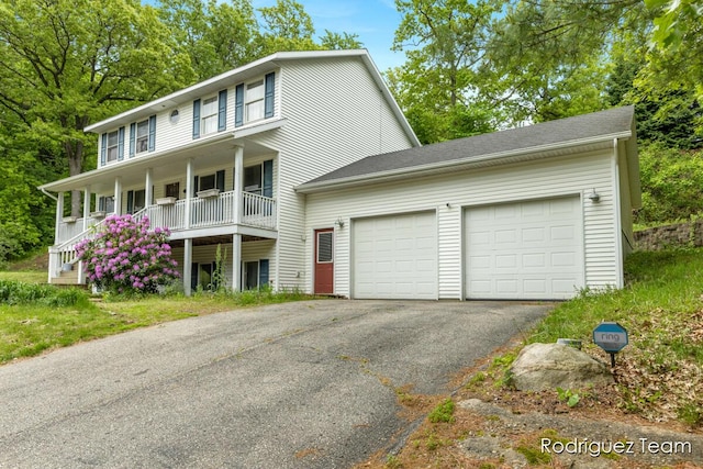 4160 Knapp Valley Dr NE, Grand Rapids, MI 49525 - colonial house featuring driveway, covered porch, and a garage