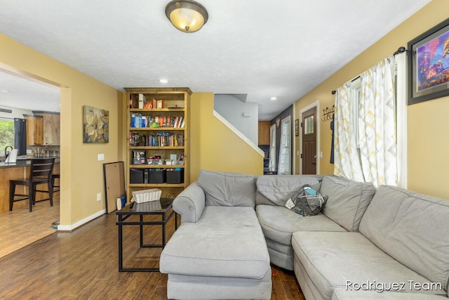 4160 Knapp Valley Dr NE, Grand Rapids, MI 49525 - living room featuring dark wood-style flooring, recessed lighting, stairway, and baseboards