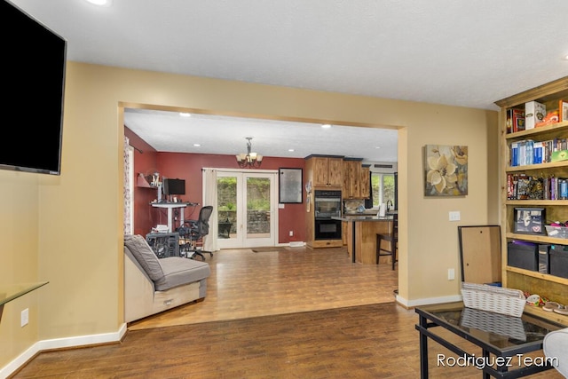 4160 Knapp Valley Dr NE, Grand Rapids, MI 49525 - living area with dark wood-type flooring, recessed lighting, baseboards, and a chandelier