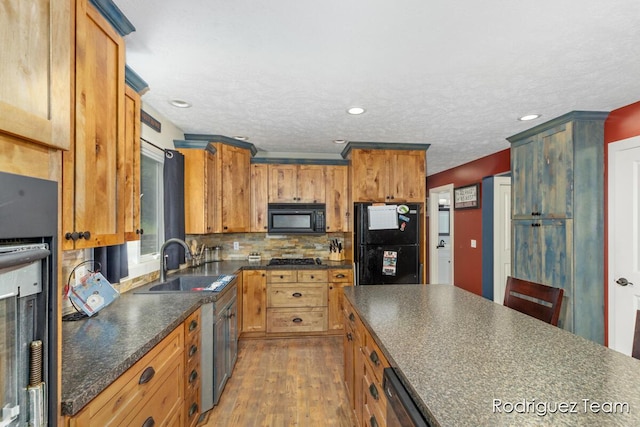 4160 Knapp Valley Dr NE, Grand Rapids, MI 49525 - kitchen featuring black microwave, a sink, dark countertops, wood finished floors, and recessed lighting