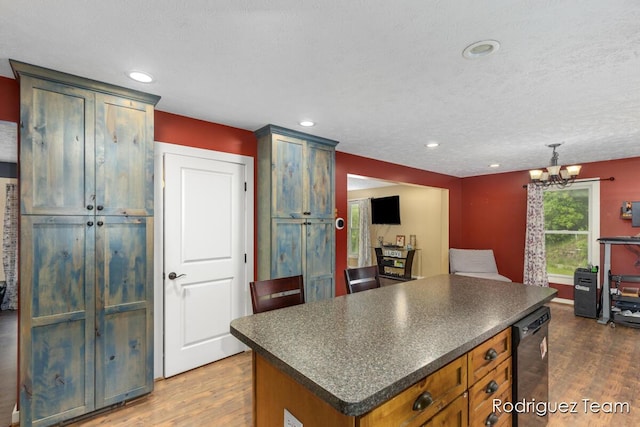 4160 Knapp Valley Dr NE, Grand Rapids, MI 49525 - kitchen featuring dark countertops, wood finished floors, a center island, dishwasher, and recessed lighting
