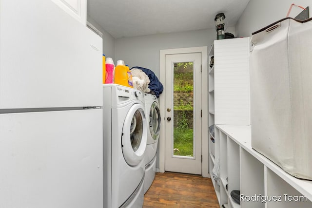 4160 Knapp Valley Dr NE, Grand Rapids, MI 49525 - washroom featuring washer and dryer and dark wood-style floors