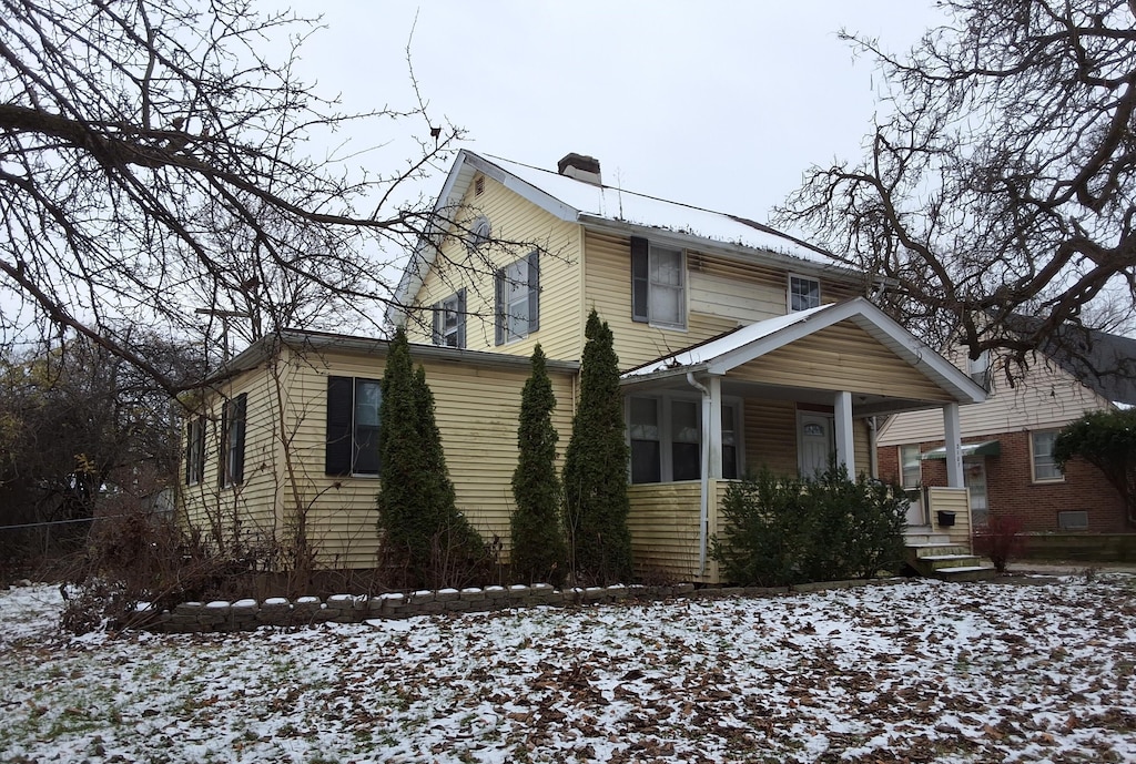 2107 Jackson Ave, Ann Arbor, MI 48103 - view of front facade with covered porch and a chimney