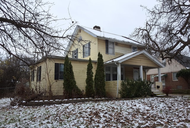 2107 Jackson Ave, Ann Arbor, MI 48103 - view of front facade with covered porch and a chimney