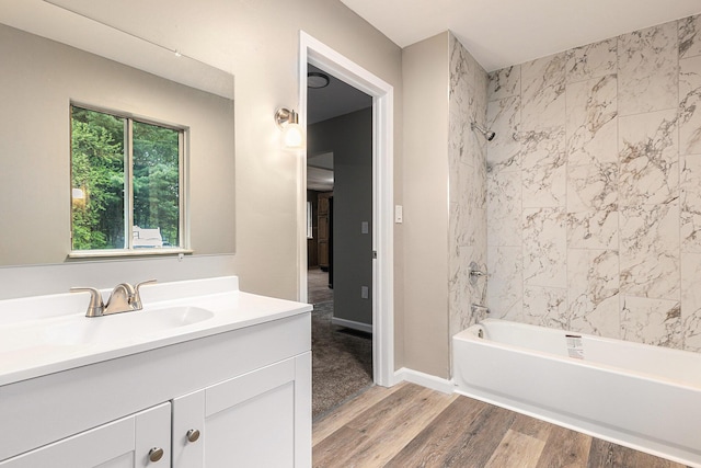 6900 Welch Lake Rd, Grass Lake, MI 49240 - bathroom with wood finished floors, vanity, and bathtub / shower combination