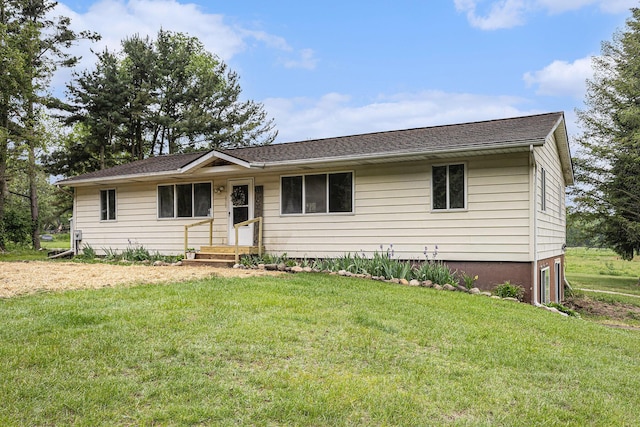 6900 Welch Lake Rd, Grass Lake, MI 49240 - ranch-style house featuring an attached garage and a front yard