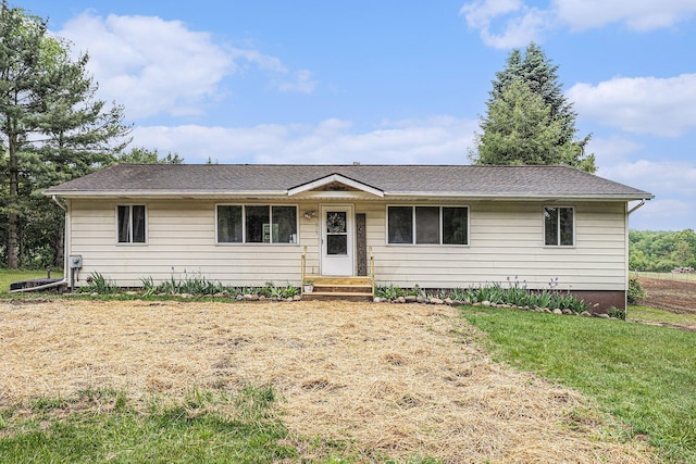 6900 Welch Lake Rd, Grass Lake, MI 49240 - ranch-style house with a front lawn and roof with shingles