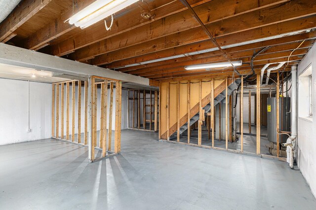 6900 Welch Lake Rd, Grass Lake, MI 49240 - unfinished below grade area featuring water heater and stairs