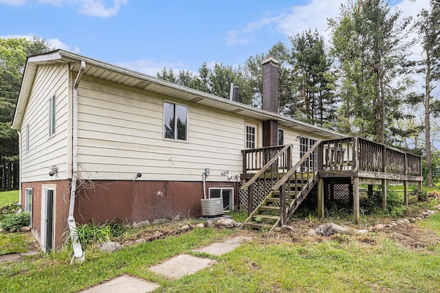 6900 Welch Lake Rd, Grass Lake, MI 49240 - rear view of property with a deck, a chimney, cooling unit, and stairway