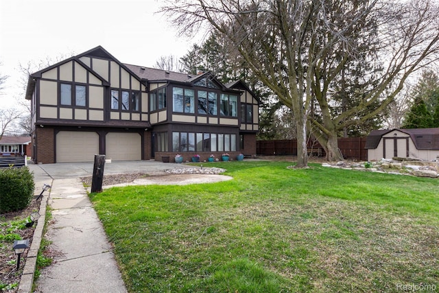 28220 Swan Island Dr, Grosse Ile, MI 48138 - back of house featuring a sunroom, brick siding, driveway, an attached garage, and stucco siding