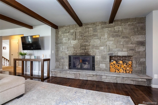 28220 Swan Island Dr, Grosse Ile, MI 48138 - living room featuring a stone fireplace, wood finished floors, beam ceiling, and baseboards
