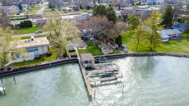 28220 Swan Island Dr, Grosse Ile, MI 48138 - dock area featuring a water view, a residential view, and boat lift