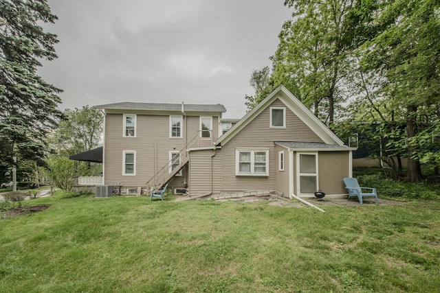 414 W Summit St, Ann Arbor, MI 48103 - back of property with a lawn, stairway, and central air condition unit