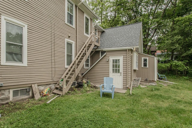 414 W Summit St, Ann Arbor, MI 48103 - back of property with stairs, a yard, and roof with shingles