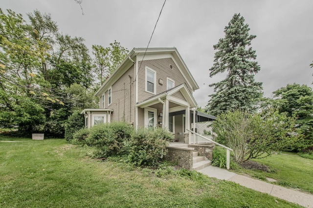 414 W Summit St, Ann Arbor, MI 48103 - view of front of property featuring covered porch and a front lawn