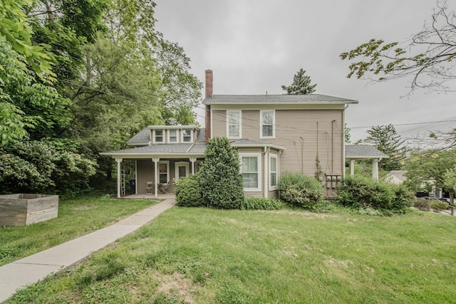 414 W Summit St, Ann Arbor, MI 48103 - back of house featuring a chimney, a porch, and a yard