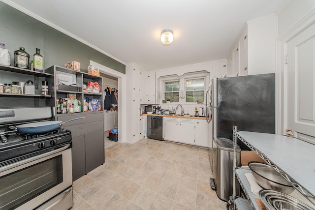 414 W Summit St, Ann Arbor, MI 48103 - kitchen with stainless steel appliances, white cabinets, a sink, open shelves, and stone finish floors