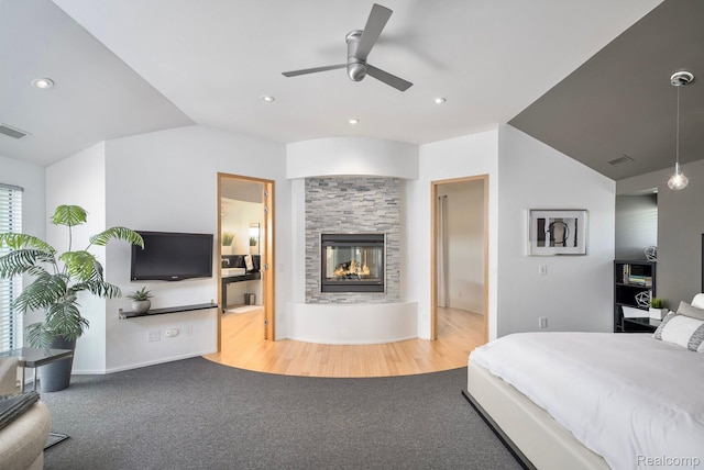 1363 Forest Bay Dr, Waterford, MI 48328 - bedroom with a multi sided fireplace, carpet flooring, recessed lighting, and baseboards