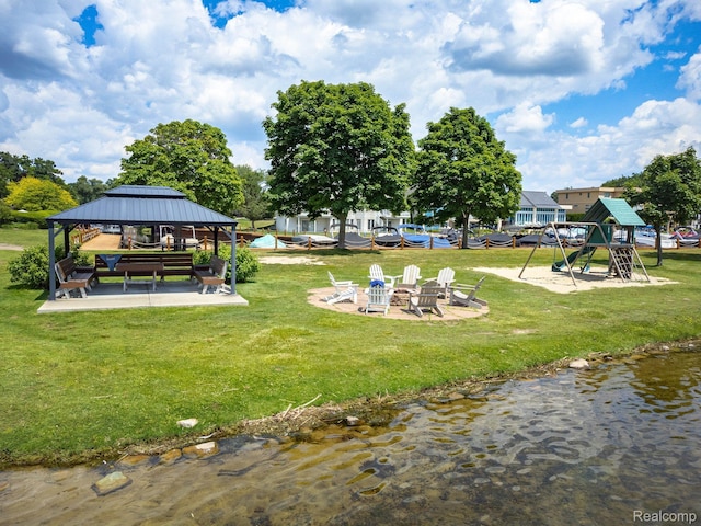 1363 Forest Bay Dr, Waterford, MI 48328 - view of grassy yard with a playground, a gazebo, and a fire pit