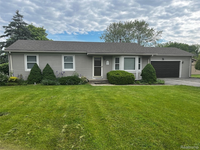 14924 Hough Rd, Allenton, MI 48002 - ranch-style home featuring a garage, asphalt driveway, a front lawn, and roof with shingles