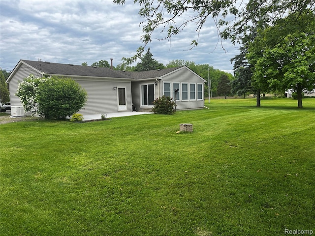 14924 Hough Rd, Allenton, MI 48002 - back of property with a patio area and a yard