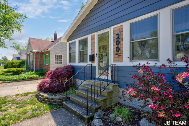 200 W 21st St, Holland, MI 49423 - entrance to property with a chimney and brick siding
