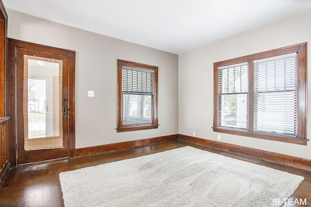 200 W 21st St, Holland, MI 49423 - spare room featuring dark wood-style flooring and baseboards