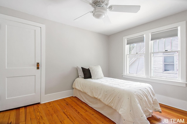 200 W 21st St, Holland, MI 49423 - bedroom with baseboards, light wood-style floors, and ceiling fan