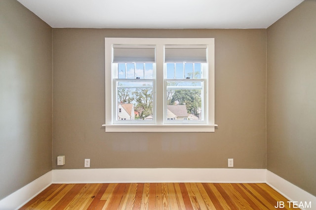 200 W 21st St, Holland, MI 49423 - empty room featuring wood finished floors and baseboards
