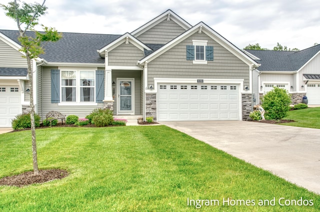 8350 Autumn Acres Dr, Rockford, MI 49341 - craftsman inspired home with stone siding, driveway, a front lawn, and roof with shingles
