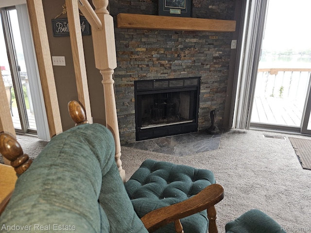2501 Davista Dr, Highland, MI 48356 - living room with carpet floors and a fireplace