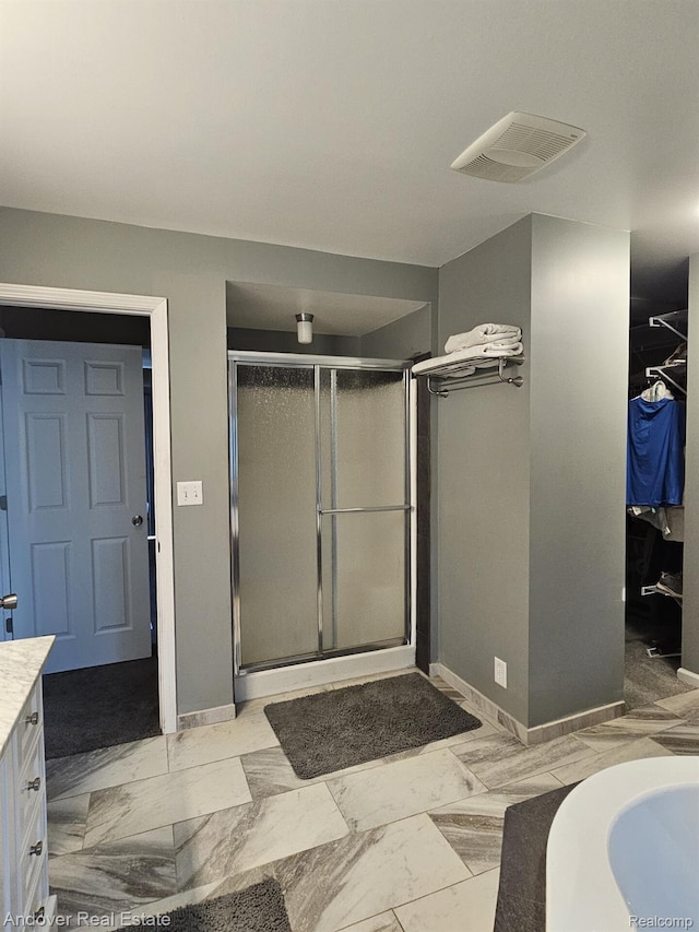 2501 Davista Dr, Highland, MI 48356 - full bathroom with vanity, a stall shower, baseboards, marble finish flooring, and a bath