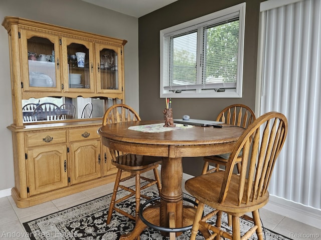 2501 Davista Dr, Highland, MI 48356 - dining room with light tile patterned floors and baseboards