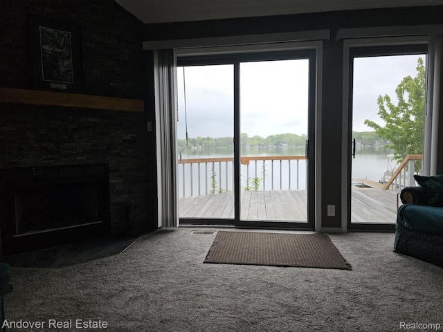 2501 Davista Dr, Highland, MI 48356 - doorway to outside with a water view, carpet flooring, and healthy amount of natural light
