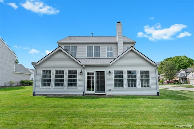 1132 Cantor Ln, South Lyon, MI 48178 - rear view of house featuring a yard and a chimney